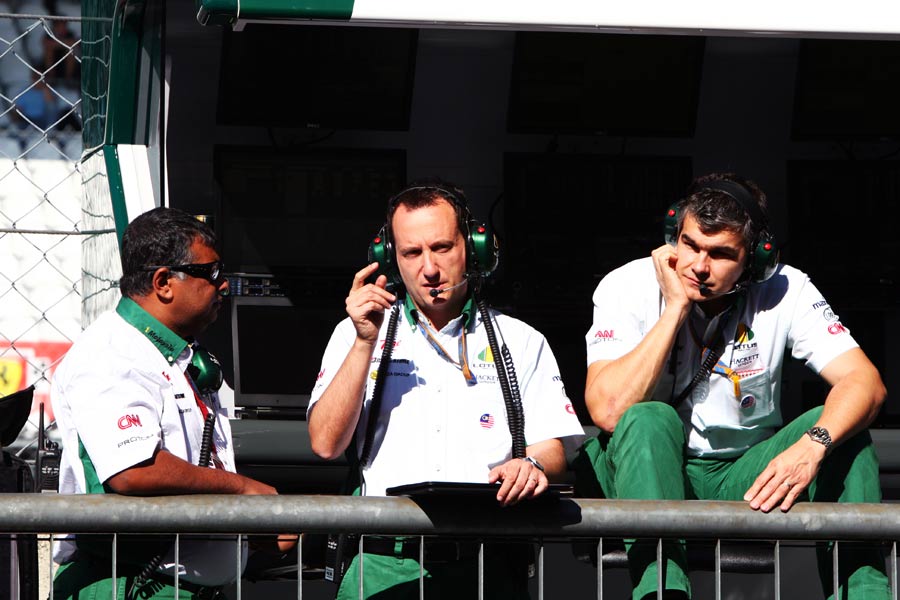 Tony Fernandes waits on the Lotus pit wall