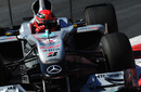 Michael Schumacher wrestles with his Mercedes during practice