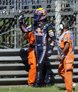 Mark Webber waves to fans after his car ground to a halt in FP3