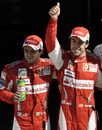 Fernando Alonso celebrates with Felipe Massa after qualifying
