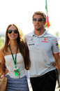 Jenson Button arrives at the circuit with girlfriend Jessica Michibata
