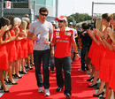 Mark Webber chats to pole-sitter Fernando Alonso before drivers' parade