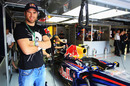 Welsh rugby player Jamie Roberts soaks up the atmosphere in the Red Bull pits