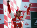 Fernando Alonso celebrates winning his first Italian Grand Prix for Ferrari in front of the Tifosi