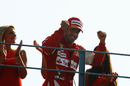 Fernando Alonso celebrates victory on the podium
