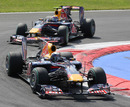 Sebastian Vettel leads Mark Webber through the first chicane