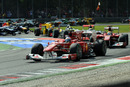 Fernando Alonso and Felipe Massa lead the field though the second chicane