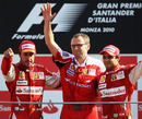Stefano Domenicali celebrates Ferrari's Monza victory with Fernando Alonso and Felipe Massa on the podium