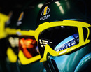 Lotus mechanics look on during qualifying