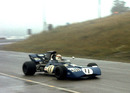 Jackie Stewart speeds through the mist and rain to win