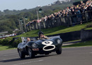 Sir Stirling Moss demonstrates a Jaguar D-Type