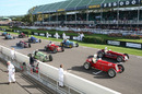 Pre-war grand prix cars line up on the grid