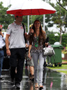 Jenson Button arrives with his girlfriend Jessica Michibata