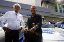 Bernie Ecclestone and safety car driver Bernd Maylander pose for photos