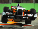 Adrian Sutil launches his car off the kerbs at turn 10