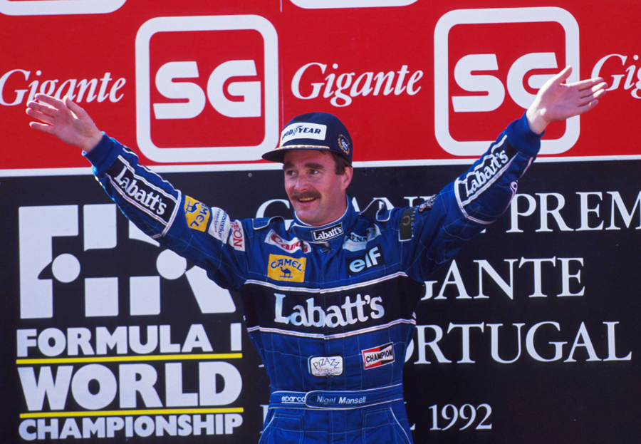 Nigel Mansell celebrates his record-breaking ninth win of the season