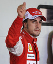 Fernando Alonso acknowledges the crowd after taking pole