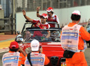 Fernando Alonso and Felipe Massa acknowledge the crowd on the parade lap