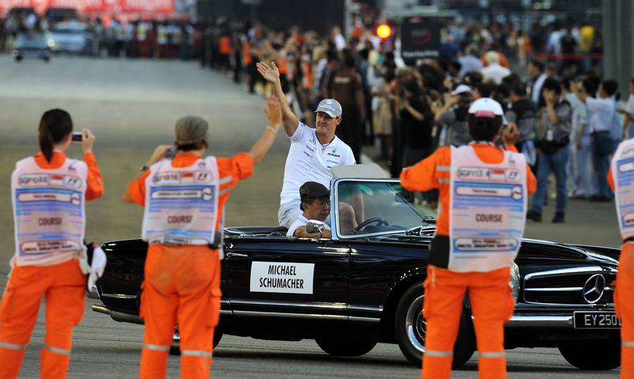Michael Schumacher acknowledges the crowd on the parade lap