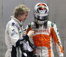 Nico Hulkenberg and Adrian Sutil share a joke after the race