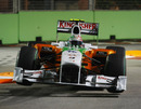 Tonio Liuzzi bounds over the kerbs at turn 10