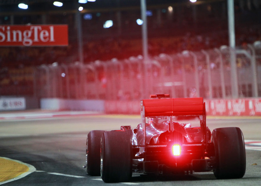 Jenson Button exits the pits