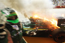 In the heat of the moment: Heikki Kovalainen looks for a fire extinguisher 