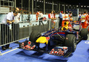McLaren engineers Jonathan Neale and Phil Prew take a look at the Red Bull in Parc Ferme