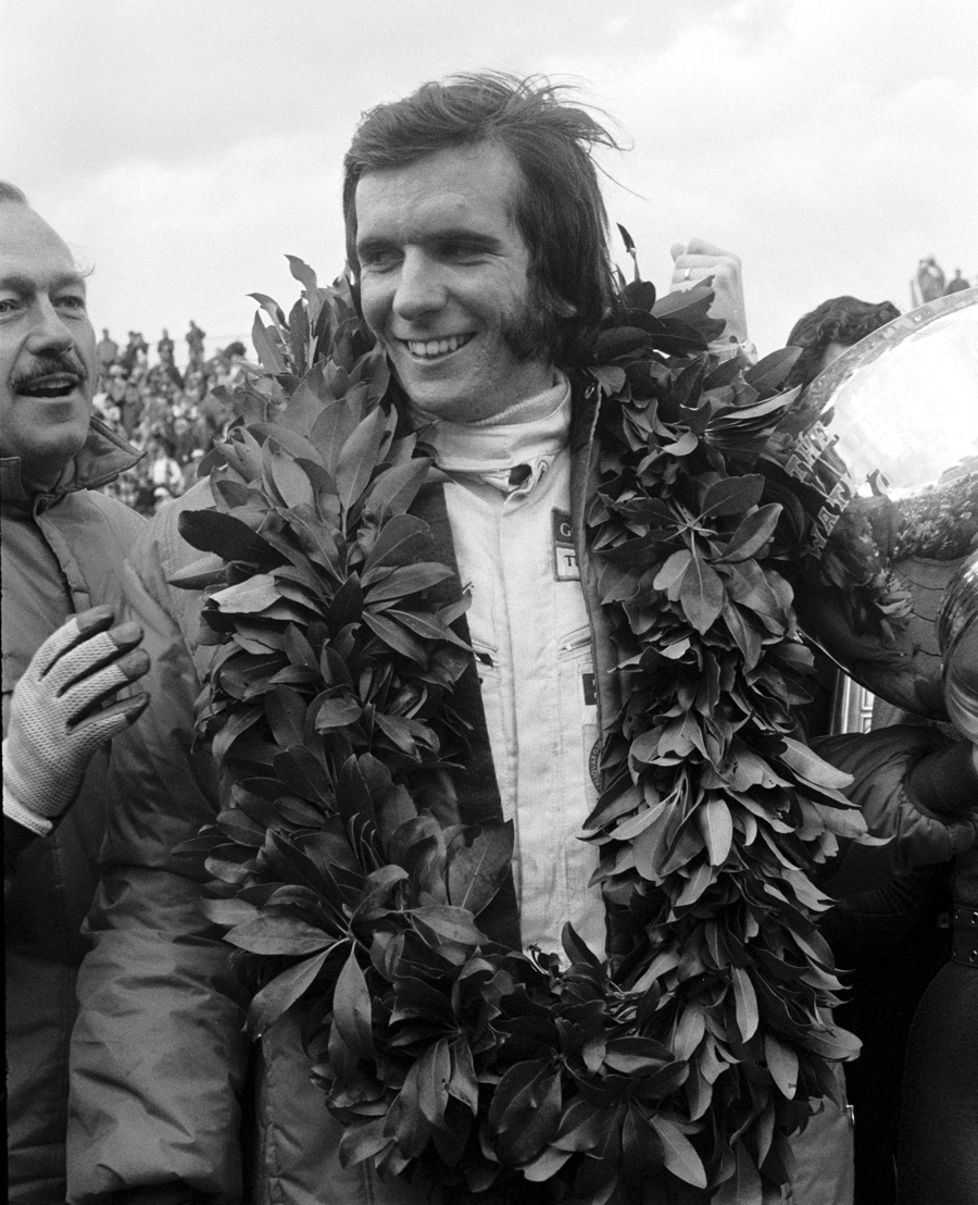 Emerson Fittipaldi celebrates victory at the 1970 US Grand Prix
