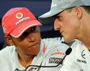 Lewis Hamilton chats to Michael Schumacher during Thursday's press conference