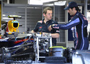 Mark Webber runs over some finer details in the pits