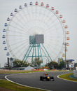 Mark Webber attacks the Suzuka circuit in his Red Bull