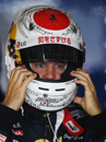 Sebastian Vettel tries on his one-off Suzuka helmet