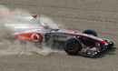 Jenson Button runs wide and into the gravel at Degner Two