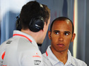 Lewis Hamilton chats to a McLaren engineer after his accident