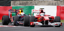 Fernando Alonso leads Sebastian Vettel during the first practice session