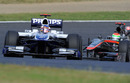 Rubens Barrichello leads Sakon Yamamoto