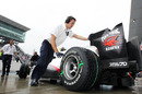 Kamui Kobayashi's Sauber is pushed back into the garage