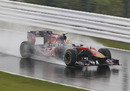 Jaime Alguersuari braves the soaking wet conditions 