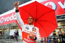 Lewis Hamilton shows his appreciation to the crowd that braved the conditions