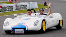 Rubens Barrichello waves to fans on the drivers' parade lap