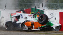 Tonio Liuzzi's Force India hits the barrier after being hit by Felipe Massa