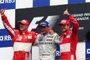 McLaren's Kimi Raikkonen is flanked by Michael Schumacher and Rubens Barrichello