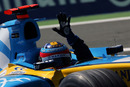 Fernando Alonso celebrates after winning the 2005 French Grand Prix