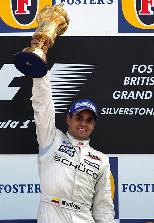 McLaren's Juan-Pablo Montoya celebrates after winning the 2005 British Grand Prix