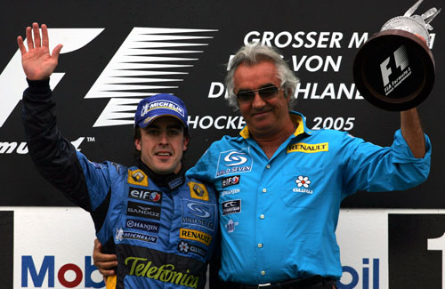 Fernando Alonso celebrates with Renault boss Flavio Briatore after winning the 2005 German Grand Prix