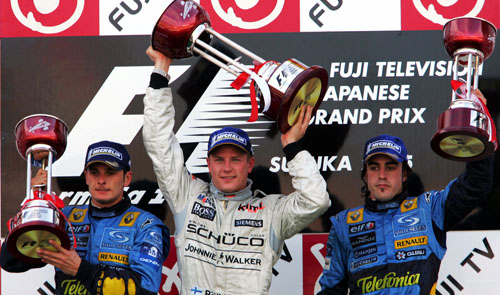 Kimi Raikkonen, Giancarlo Fisichella, Fernando Alonso on the podium at the 2005 Japanese Grand Prix