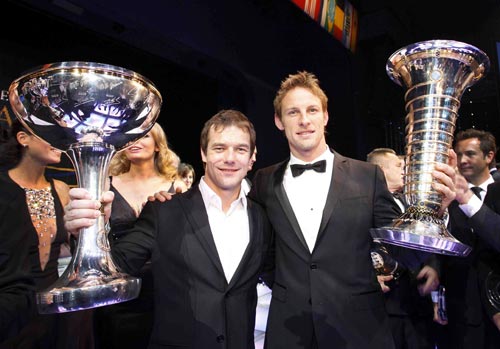 Two world champions, Jenson Button and WRC champion Sebastien Loeb with their trophies