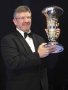 Ross Brawn collects the championship trophy on behalf of Brawn GP