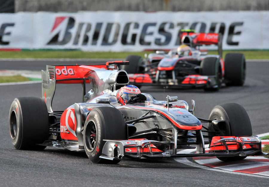 Jenson Button leads Lewis Hamilton early in the race